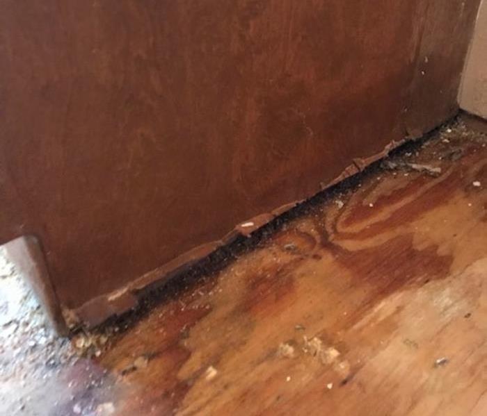 Removed flooring to show damaged floors