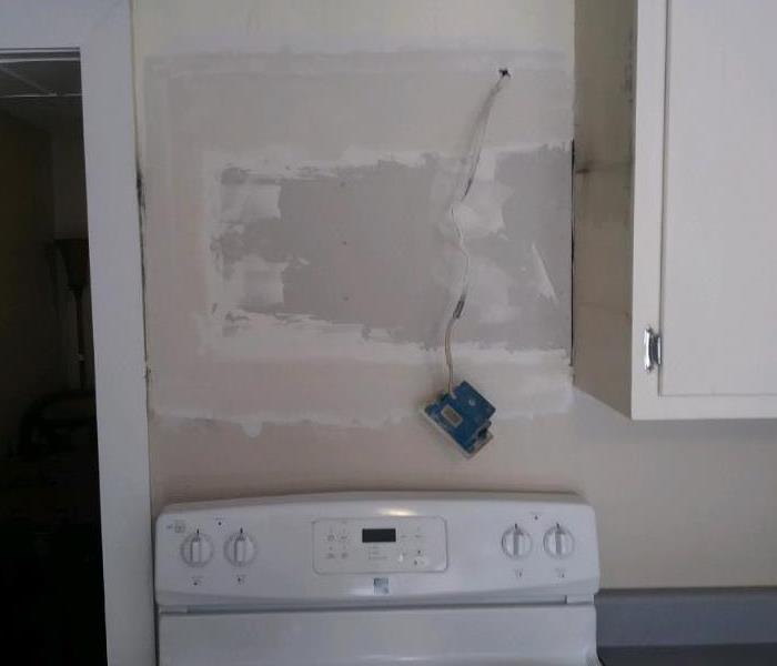 Patched wall after Microwave Fire